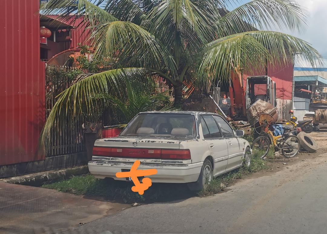 One of the abandoned cars at the roadside.