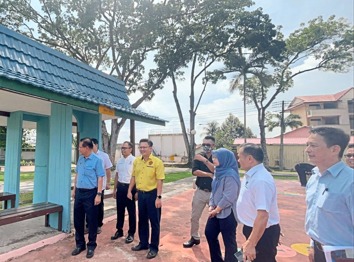 Lee (left) checking on the facilities at Rejang Park Traffic Garden.