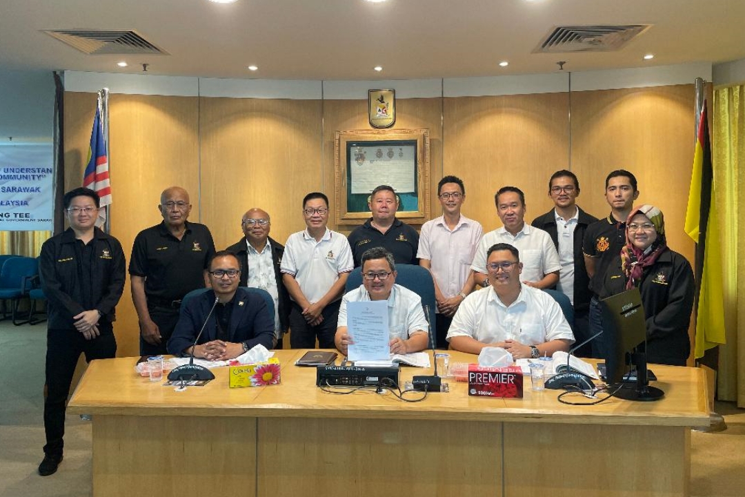 Ting (seated centre) and Public Health, Environment and Municipal Services officers at the press conference.