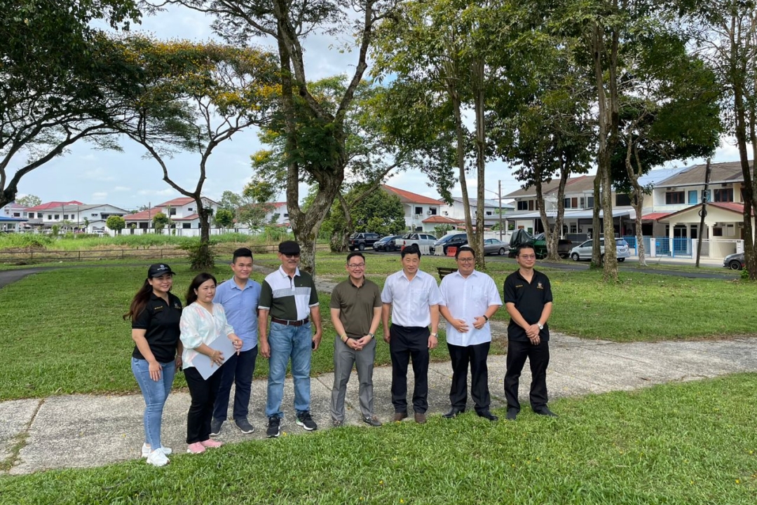Tiang (fifth left) and others pose at the newly upgraded park at Lorong Lim Han Swee 8.
