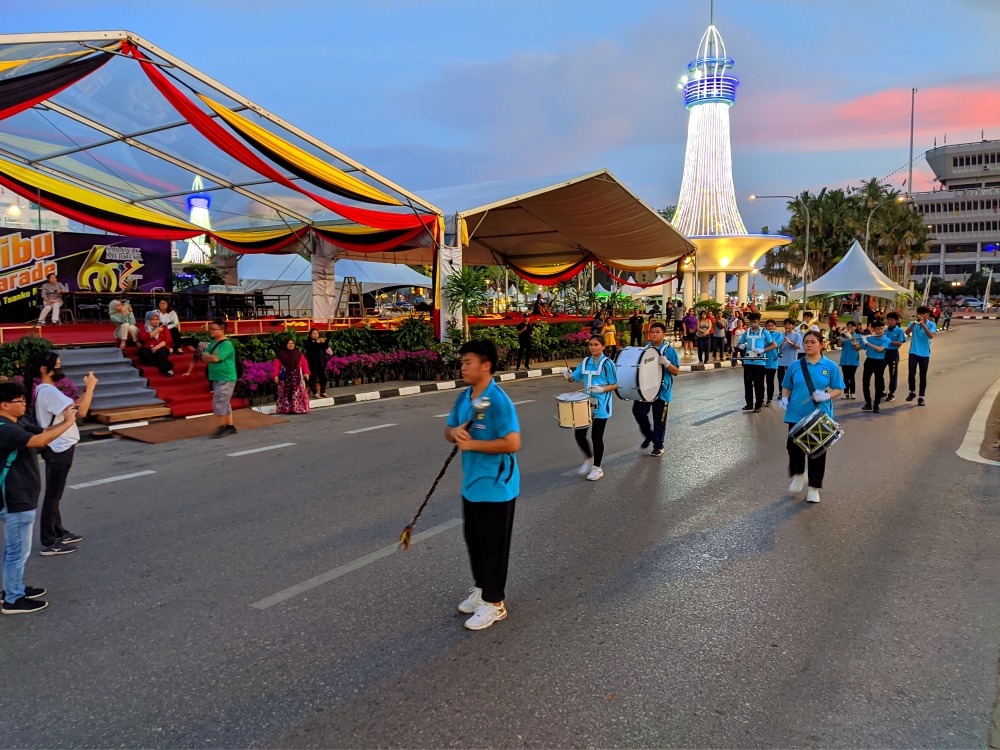 A school band passes the grand stand during the Sibu Street Parade rehearsal tonight. – Photo by Peter Boon