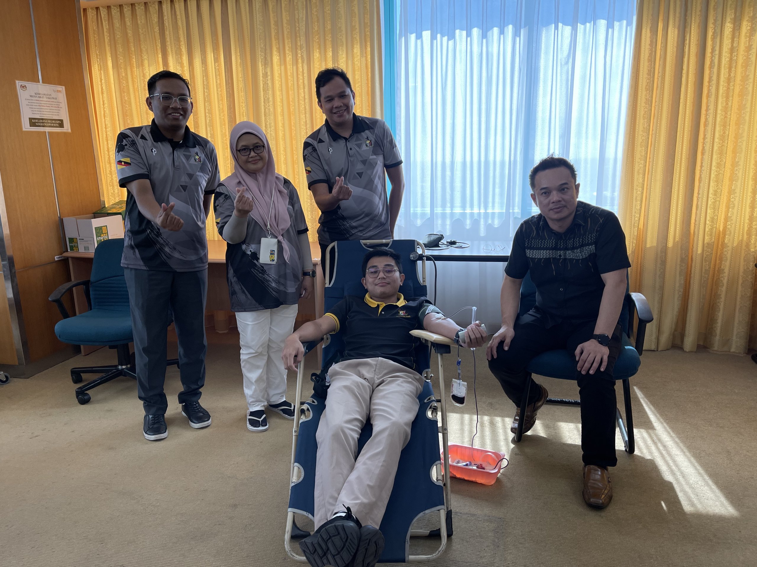 Normawati with SMC Sports and Social Club members during the blood drive.