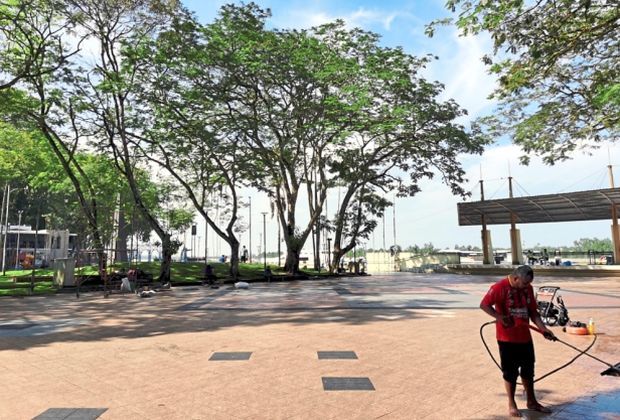 A worker cleaning the esplanade in Sibu.