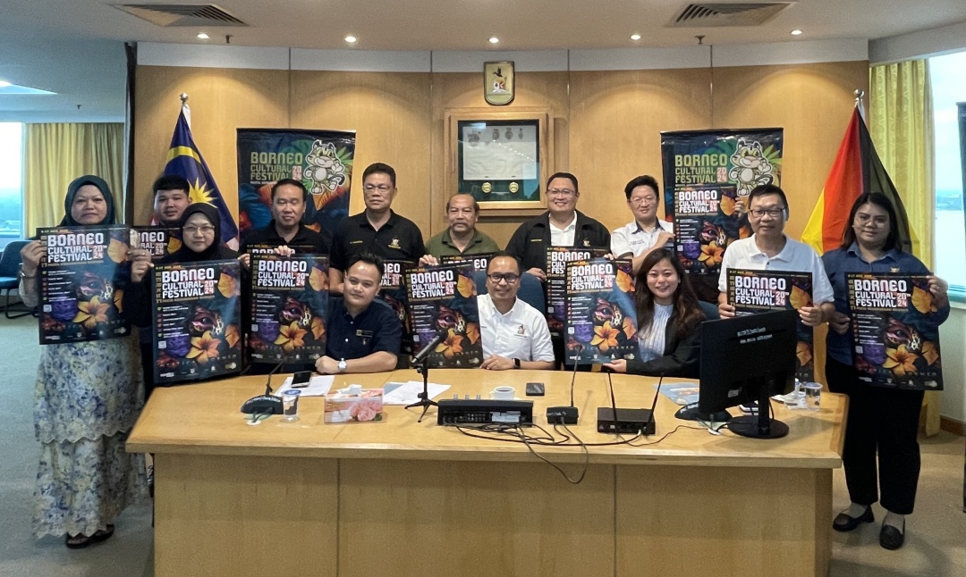 Izkandar (seated centre) and his team show the BCF 2024 posters.