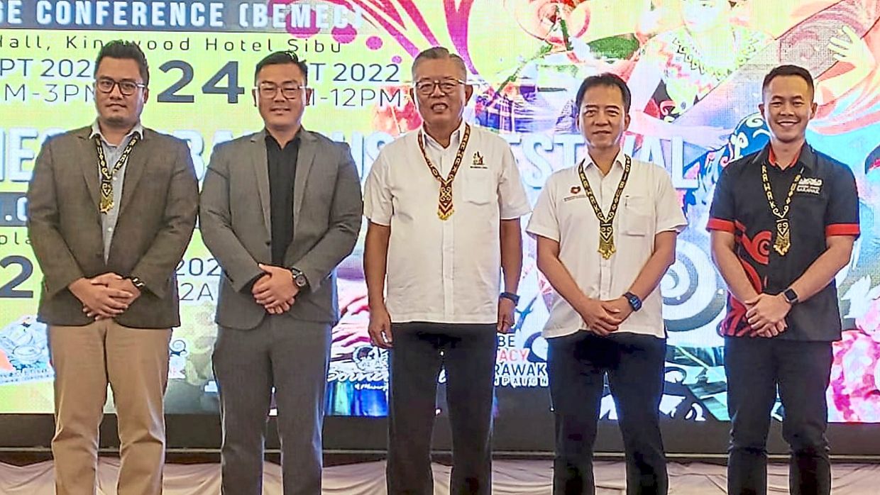 Ting (centre) with Gan (second from left) and other officials at the conference launch.