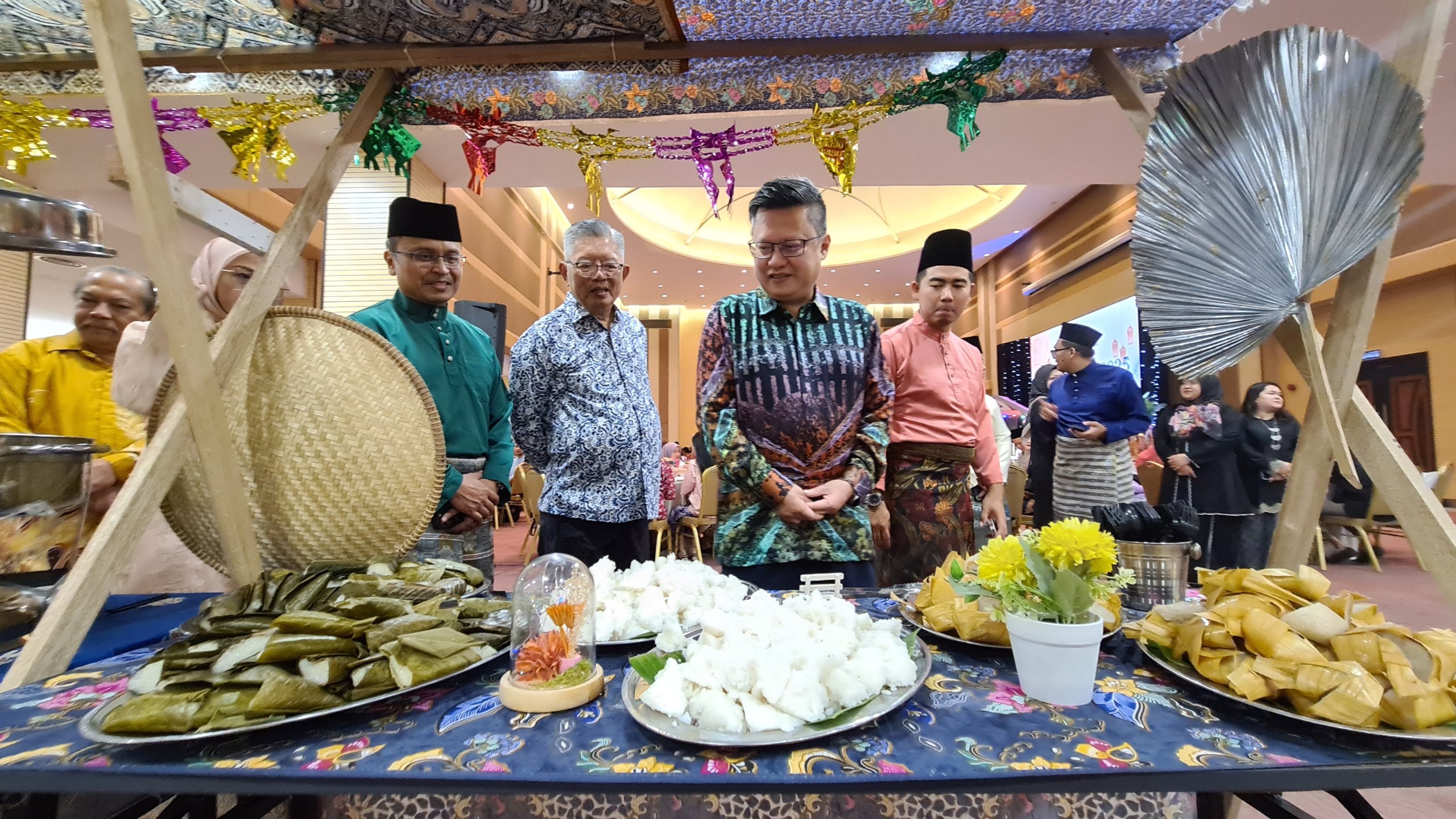 (From left) Mohammed Abdullah, Clarence, Chieng, and Raden Khairulzaman visit one of the stalls serving traditional village-style dishes that evoke nostalgic memories of Hari Raya in the old days.