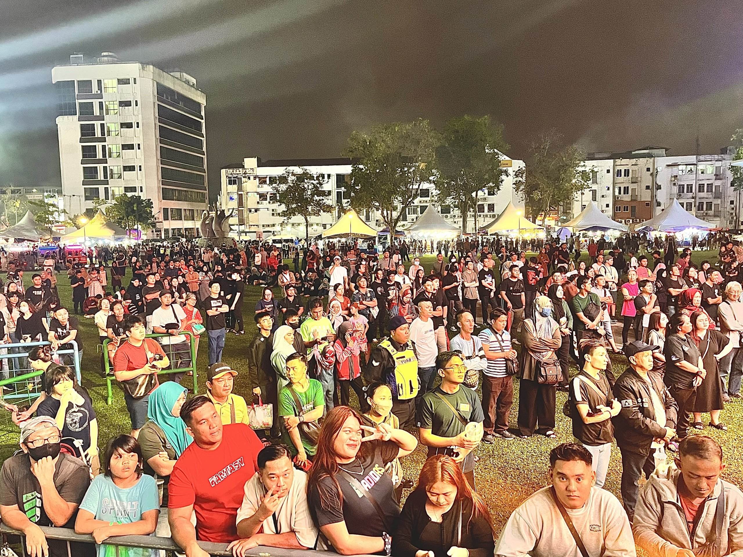 A section of the crowds gathering at the Sibu Town Square for the 2024 New Year countdown