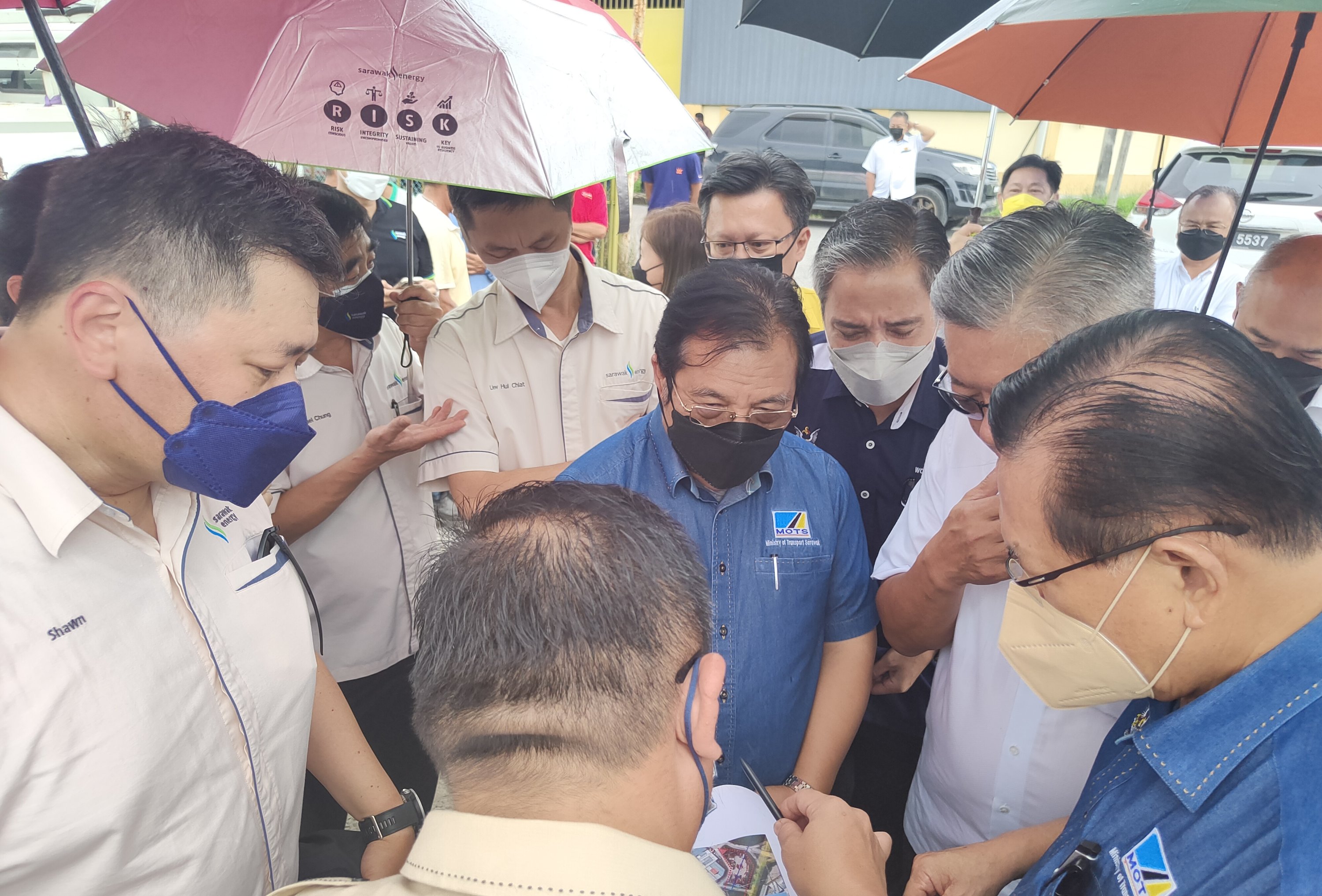 Lee (right) during a briefing on the site at Jalan Ding Lik Kwong in Sibu. Seen from his right are Ting and Dr Jerip. — Photo by Peter Boon