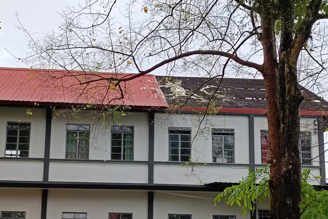 Strong winds lifted off the roofs of SMK Sacred Heart. – Photo by Peter Boon