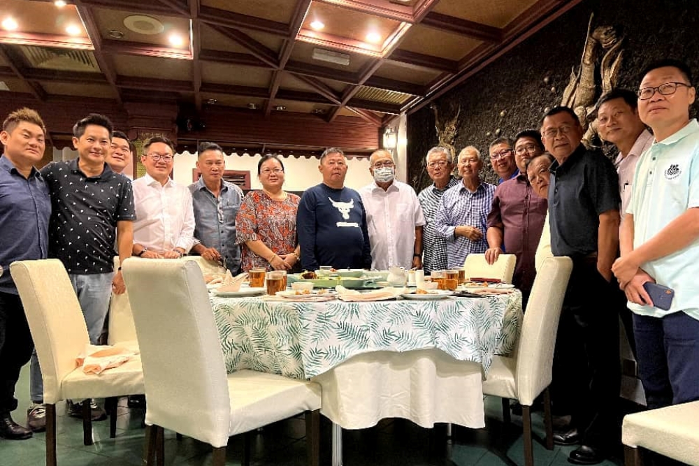 A photo posted by Clarence, together with his message of condolences, on his Facebook page shows Andy (left) and fellow SMC councillor Miri Mayor Adam Yii (eighth left) during a dinner event in Kuching.