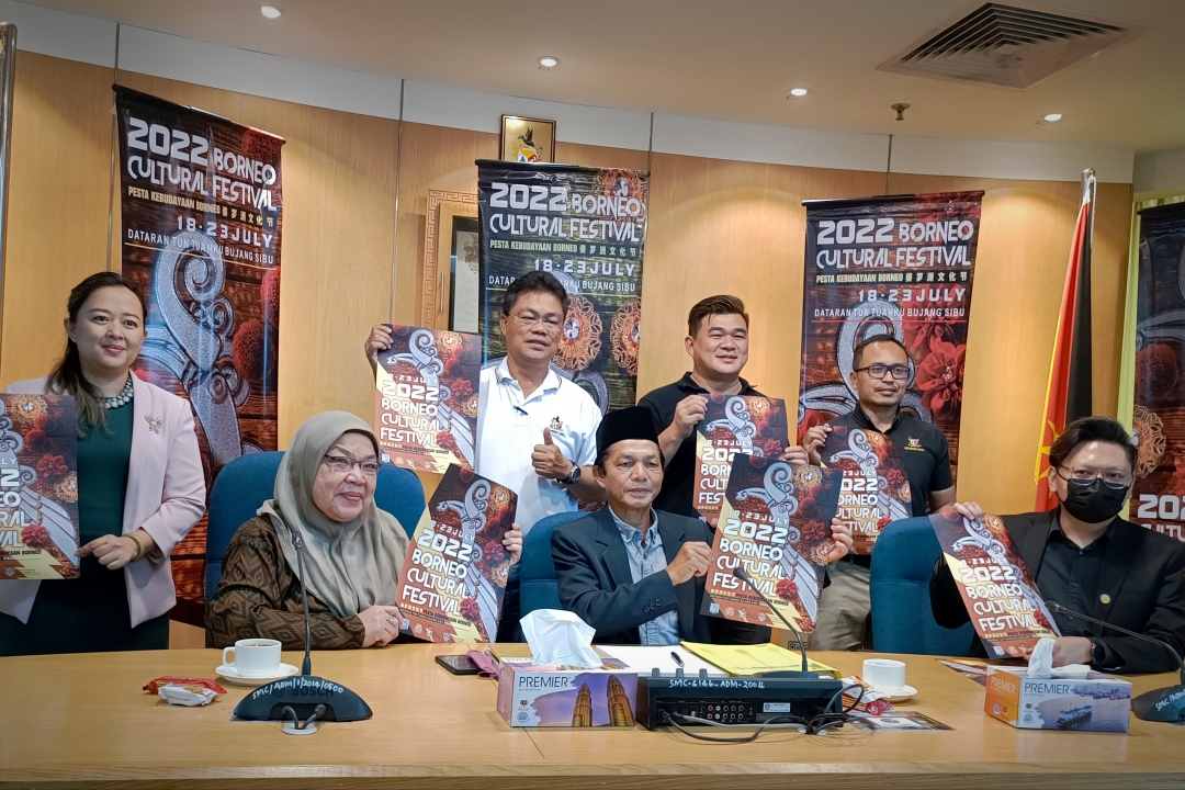 (Seated center) Bujang, SMC Social and Community Development Standing Committee chairperson Councillor Zaiton Abdul Kader (seated left), SMC head of coordination (administration) McCrea Joseph Pererra (seated right), while (standing from left) councillors Nazatusyima Bujang, Augustine Merikan, Ling Hua Wee and Mohammed Abdullah Iskandar Roseley show posters for BCF 2022. – Photo by Peter Boon