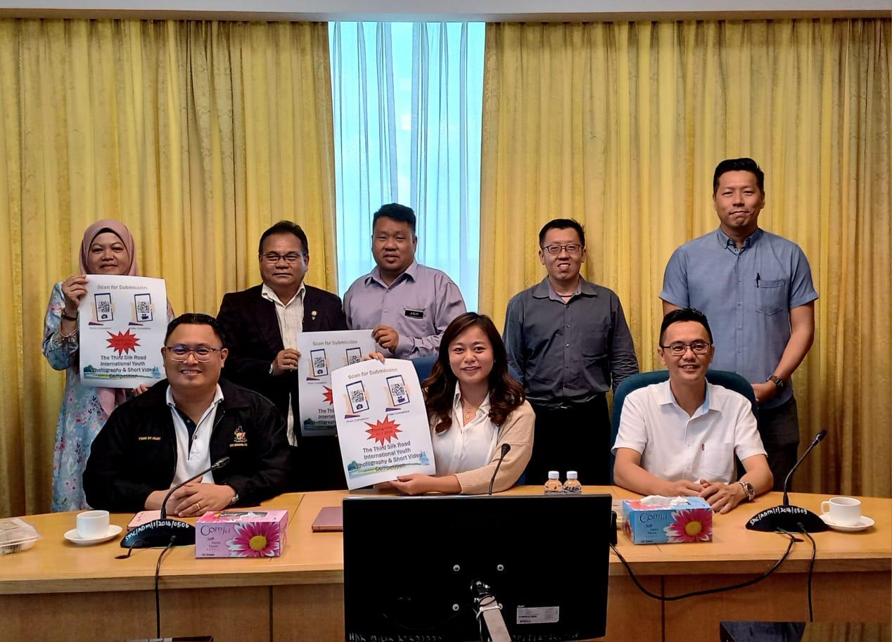 Law (seated, centre) and others promoting the competition during the press conference.