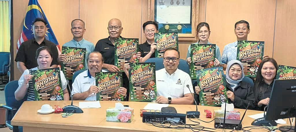 Mohammed Abdullah Izkandar (seated centre) with SMC councillors and council staff holding BCF 2025 publicity posters.